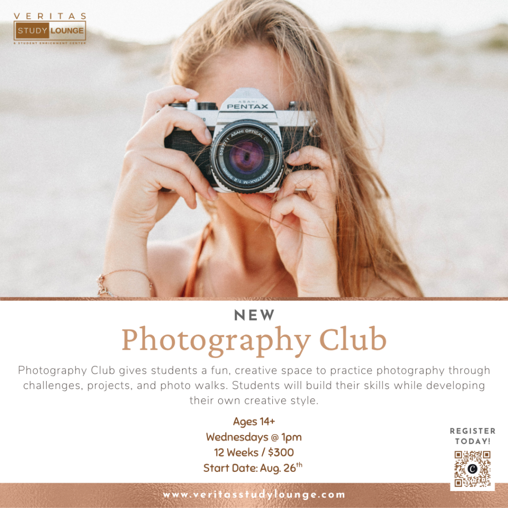 Veritas Study Lounge Photography Club: Woman holding a vintage Pentax camera